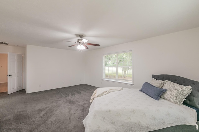 1503 County Road 705, Joshua, TX 76058 - bedroom with dark colored carpet and a ceiling fan