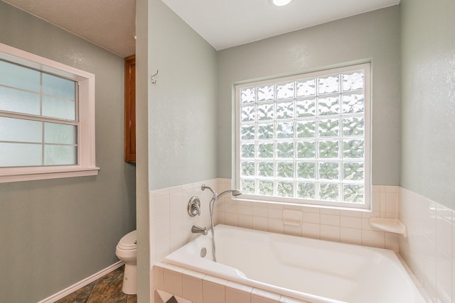1503 County Road 705, Joshua, TX 76058 - full bath featuring toilet, a bath, and baseboards