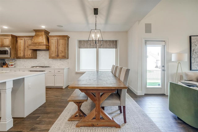 9925 Chaparral Pass, Fort Worth, TX 76126 - kitchen featuring custom exhaust hood, stainless steel microwave, light countertops, decorative backsplash, and dark wood finished floors