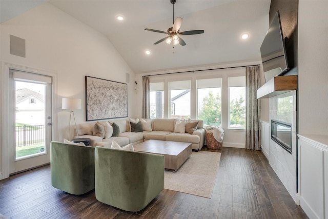 9925 Chaparral Pass, Fort Worth, TX 76126 - living area featuring plenty of natural light, a tile fireplace, ceiling fan, dark wood finished floors, and high vaulted ceiling