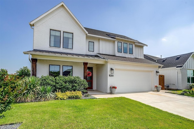 9925 Chaparral Pass, Fort Worth, TX 76126 - view of front of house with brick siding, a standing seam roof, concrete driveway, a garage, and board and batten siding