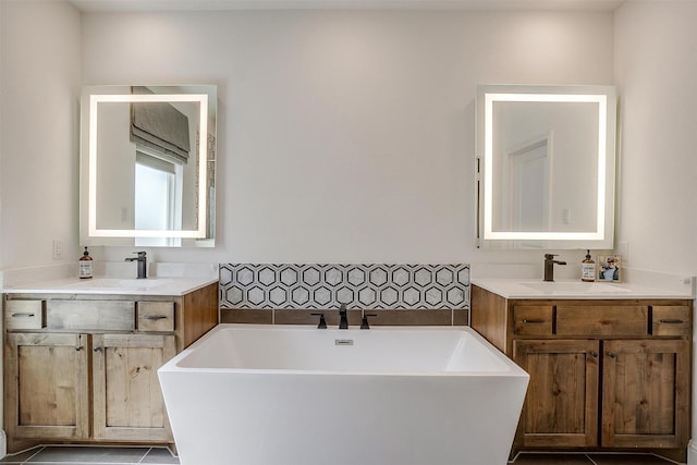 9925 Chaparral Pass, Fort Worth, TX 76126 - full bath with a soaking tub, two vanities, and tile patterned floors