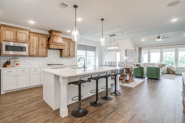 9925 Chaparral Pass, Fort Worth, TX 76126 - kitchen with stainless steel microwave, premium range hood, a sink, plenty of natural light, and recessed lighting