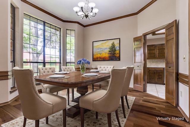 1504 Huron Trl, Plano, TX 75075 - dining area with a chandelier, wood finished floors, and crown molding