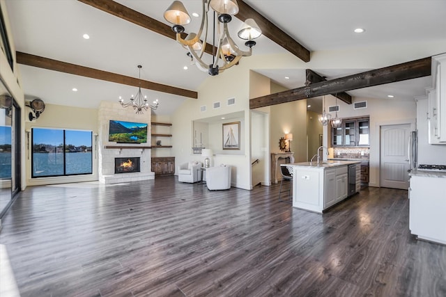 523 Contour Dr, Granite Shoals, TX 78654 - kitchen featuring a chandelier, a center island with sink, white cabinetry, open floor plan, and recessed lighting