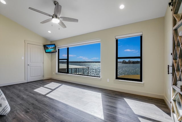 523 Contour Dr, Granite Shoals, TX 78654 - spare room with vaulted ceiling, wood finished floors, baseboards, ceiling fan, and recessed lighting