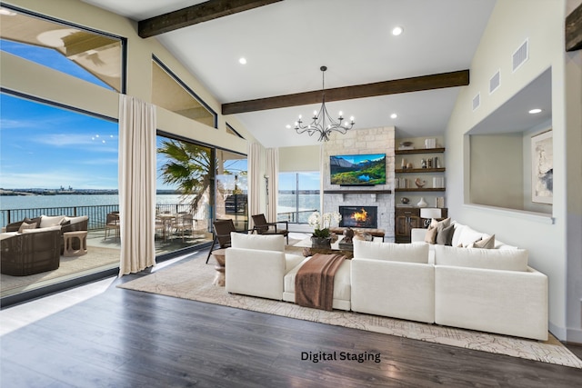 523 Contour Dr, Granite Shoals, TX 78654 - living room with a water view, a fireplace, wood finished floors, a chandelier, and recessed lighting