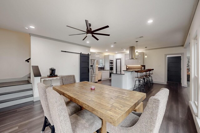 2003 Quincy Ct, Arlington, TX 76013 - dining area featuring a barn door, dark wood finished floors, recessed lighting, a ceiling fan, and stairs