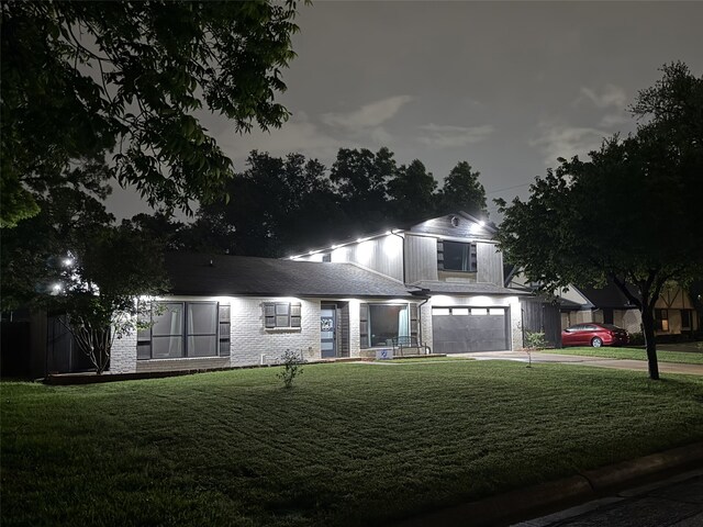 2003 Quincy Ct, Arlington, TX 76013 - view of front of property with an attached garage, concrete driveway, a front yard, and brick siding