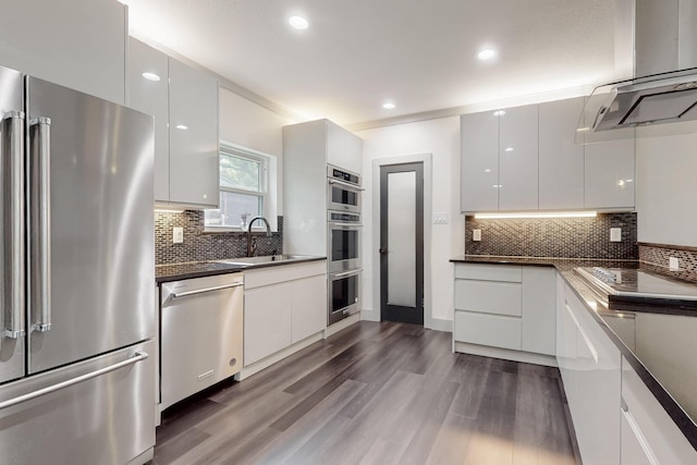2003 Quincy Ct, Arlington, TX 76013 - kitchen featuring stainless steel appliances, modern cabinets, a sink, white cabinets, and recessed lighting