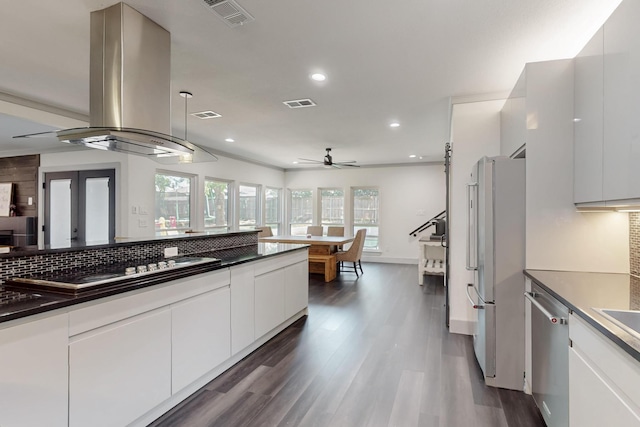 2003 Quincy Ct, Arlington, TX 76013 - kitchen featuring freestanding refrigerator, island exhaust hood, stainless steel dishwasher, backsplash, and recessed lighting