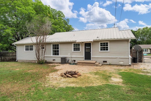 738 Randy Dr, Woodway, TX 76712 - rear view of property featuring crawl space, metal roof, an outdoor fire pit, and cooling unit