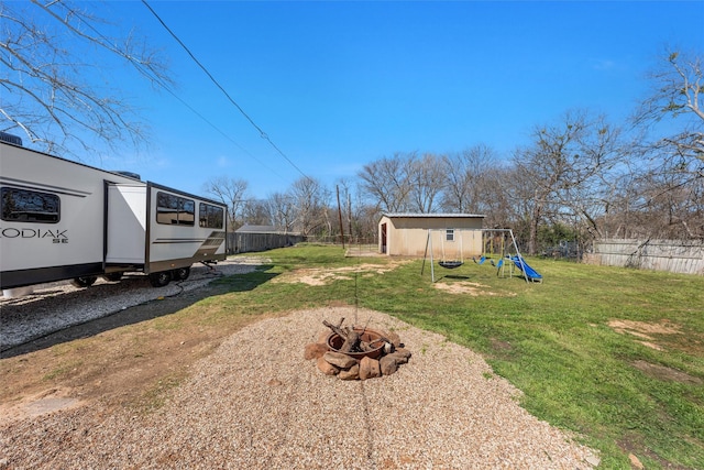 738 Randy Dr, Woodway, TX 76712 - view of yard with a fire pit and a playground