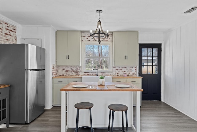 738 Randy Dr, Woodway, TX 76712 - kitchen with freestanding refrigerator, butcher block countertops, and wood finished floors