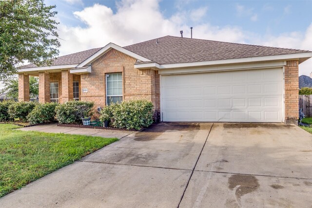 2101 Thistle Ln, Forney, TX 75126 - single story home featuring driveway, brick siding, a shingled roof, and an attached garage