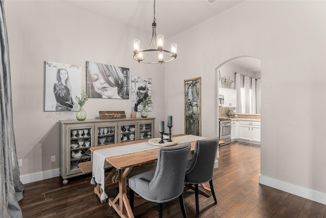 3659 Smoketree Dr, Rockwall, TX 75032 - dining room featuring arched walkways, a chandelier, and dark wood-style floors