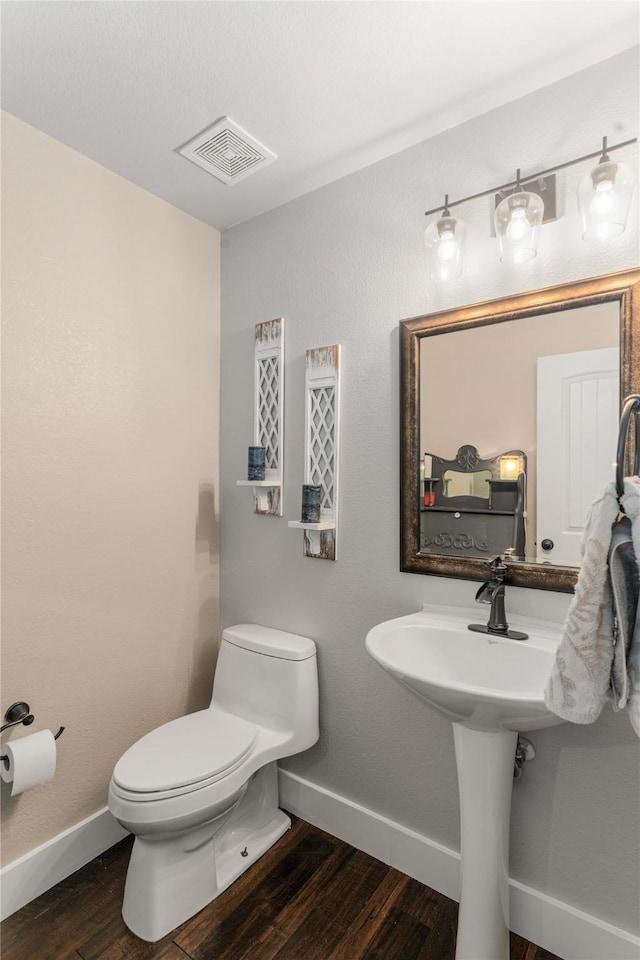 3659 Smoketree Dr, Rockwall, TX 75032 - bathroom with wood finished floors and toilet