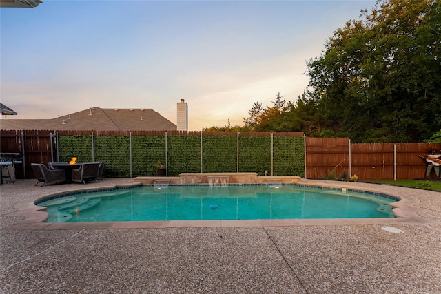 3659 Smoketree Dr, Rockwall, TX 75032 - pool at dusk with a patio area