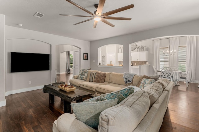 3659 Smoketree Dr, Rockwall, TX 75032 - living room with ceiling fan, arched walkways, dark wood-style floors, and plenty of natural light