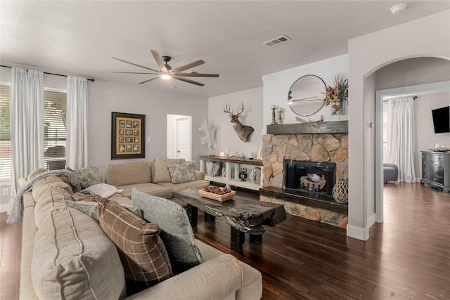 3659 Smoketree Dr, Rockwall, TX 75032 - living area with arched walkways, a ceiling fan, hardwood / wood-style flooring, and a fireplace