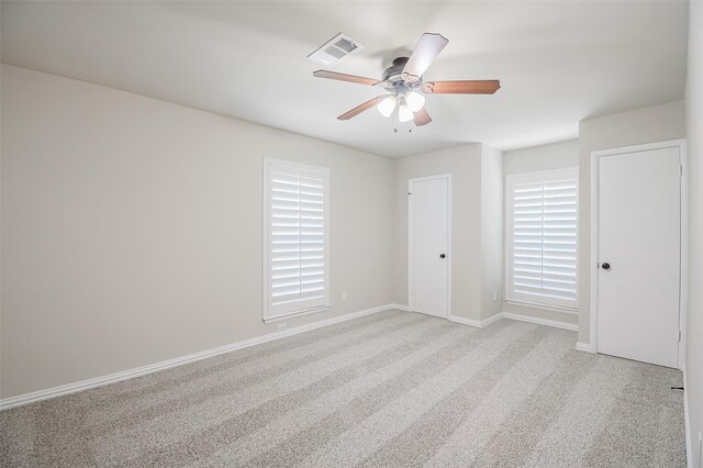 3313 Country Club Rd, Pantego, TX 76013 - unfurnished bedroom with carpet flooring, a ceiling fan, and multiple windows