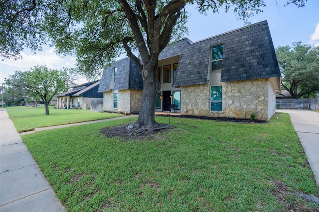 3313 Country Club Rd, Pantego, TX 76013 - view of front of home featuring stone siding, mansard roof, concrete driveway, and roof with shingles