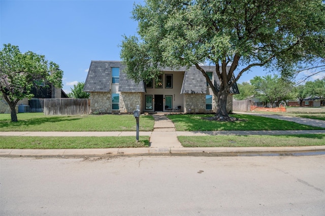 3313 Country Club Rd, Pantego, TX 76013 - view of property with stone siding and mansard roof