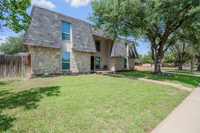 3313 Country Club Rd, Pantego, TX 76013 - view of front of property featuring mansard roof, stone siding, a shingled roof, and stucco siding