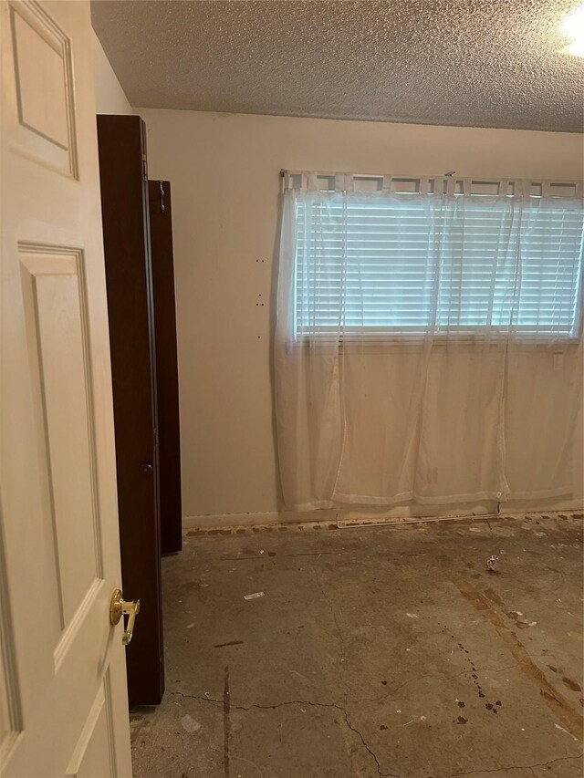 2410 Asbury St, Brownwood, TX 76801 - empty room with a textured ceiling
