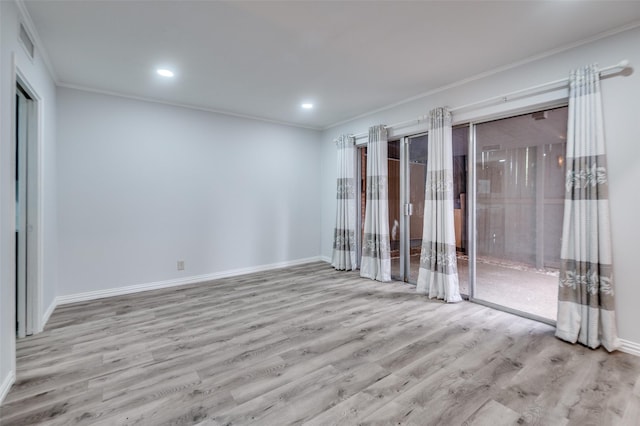 576 E Ave J Unit B, Grand Prairie, TX 75050 - empty room with wood finished floors, ornamental molding, baseboards, and recessed lighting