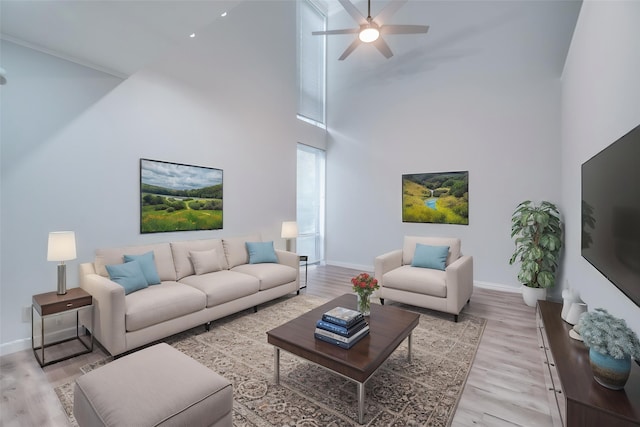 576 E Ave J Unit B, Grand Prairie, TX 75050 - living area featuring a high ceiling, a ceiling fan, baseboards, and light wood finished floors