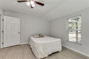128 Stephens St, Waxahachie, TX 75165 - bedroom featuring light wood-style floors, vaulted ceiling, baseboards, and ceiling fan