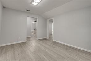 128 Stephens St, Waxahachie, TX 75165 - unfurnished room featuring wood finished floors, lofted ceiling, and baseboards