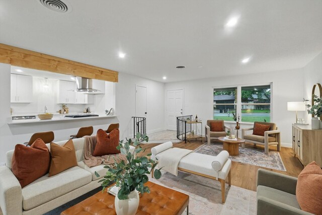 6304 Circleview Dr, Haltom City, TX 76180 - living area with wood finished floors, recessed lighting, and baseboards