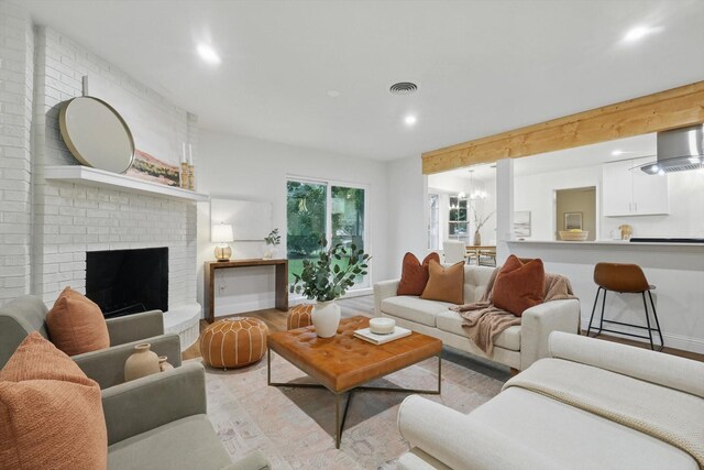 6304 Circleview Dr, Haltom City, TX 76180 - living room with recessed lighting, light wood-type flooring, baseboards, and a brick fireplace