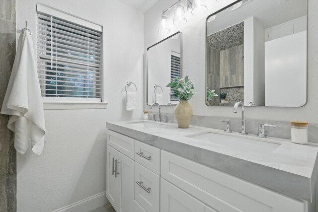 6304 Circleview Dr, Haltom City, TX 76180 - full bathroom featuring double vanity and baseboards
