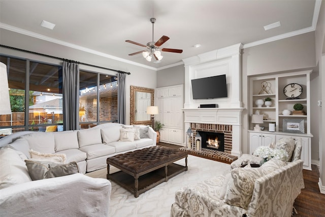 1229 Comanche Dr, Allen, TX 75013 - living area with a ceiling fan, ornamental molding, wood finished floors, and a brick fireplace