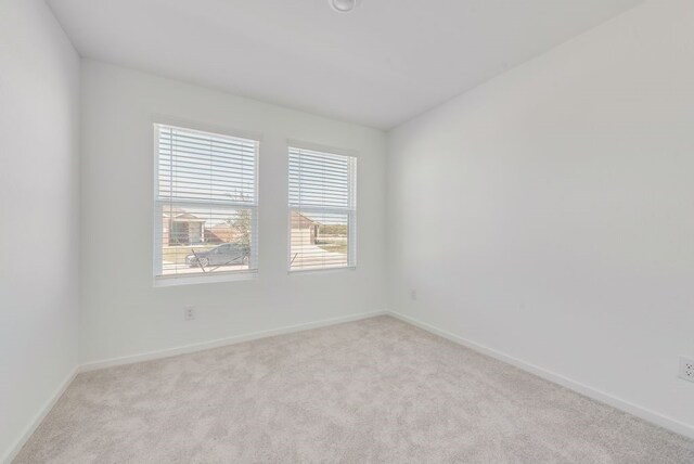 7712 Reese St, Dallas, TX 75114 - empty room with light colored carpet and baseboards