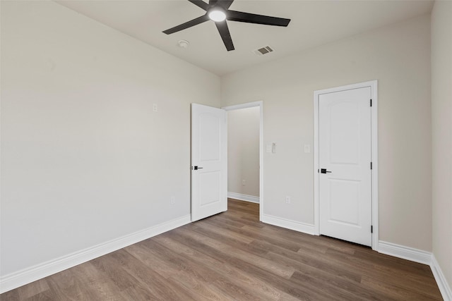 10917 Granada Dr, Waco, TX 76708 - unfurnished bedroom featuring wood finished floors, baseboards, and ceiling fan