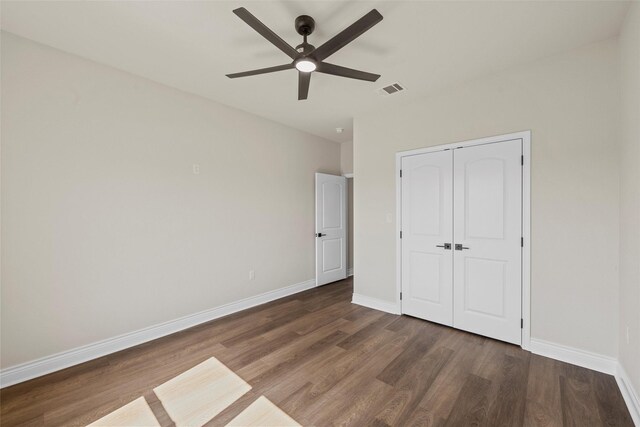 10917 Granada Dr, Waco, TX 76708 - unfurnished bedroom with wood finished floors, baseboards, and a closet