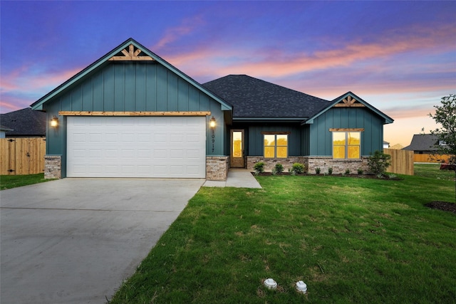 10917 Granada Dr, Waco, TX 76708 - view of front facade featuring board and batten siding, a shingled roof, driveway, an attached garage, and stone siding