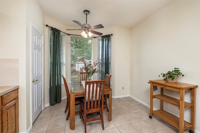 10325 Hogan Dr, Benbrook, TX 76126 - dining space featuring a ceiling fan, light tile patterned floors, and baseboards
