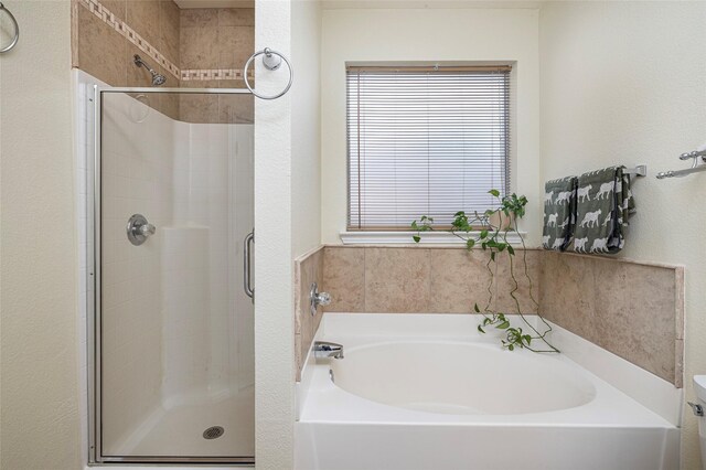 10325 Hogan Dr, Benbrook, TX 76126 - bathroom featuring a shower stall and a garden tub