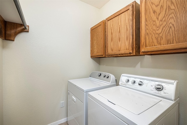 10325 Hogan Dr, Benbrook, TX 76126 - laundry room featuring cabinet space, separate washer and dryer, and baseboards