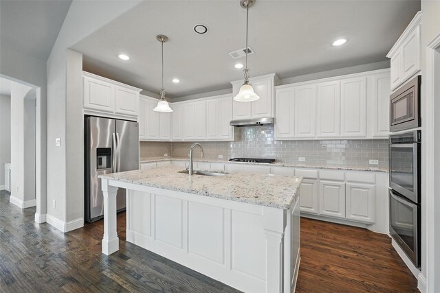2004 Long Park Ave, Prosper, TX 75078 - kitchen with appliances with stainless steel finishes, a sink, under cabinet range hood, tasteful backsplash, and white cabinets