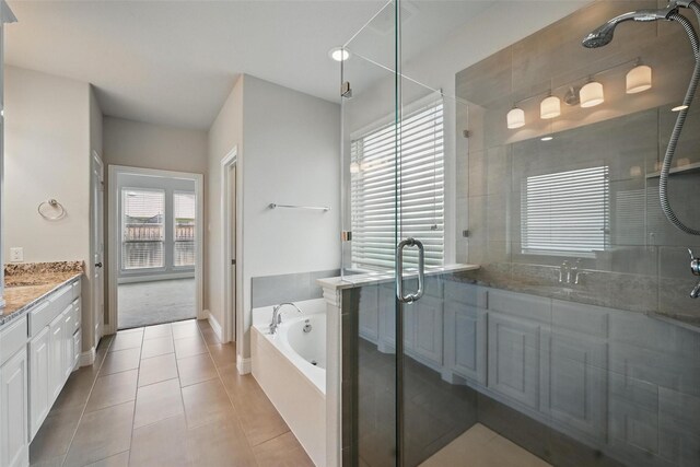 2004 Long Park Ave, Prosper, TX 75078 - bathroom featuring a shower stall, vanity, a bath, and tile patterned flooring