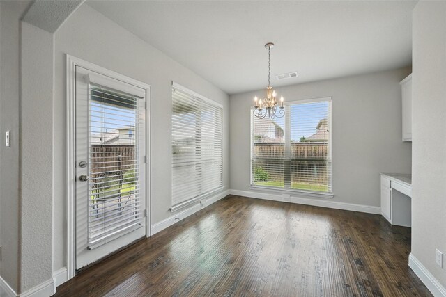 2004 Long Park Ave, Prosper, TX 75078 - unfurnished dining area with dark wood finished floors, a chandelier, and baseboards
