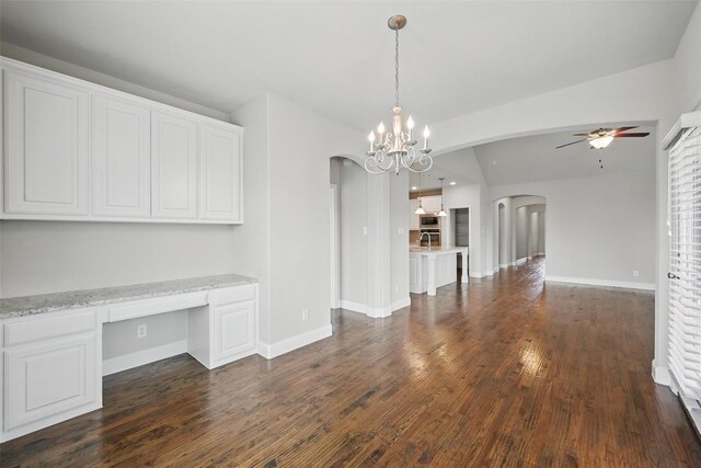 2004 Long Park Ave, Prosper, TX 75078 - unfurnished dining area with arched walkways, ceiling fan, dark wood-style floors, and baseboards
