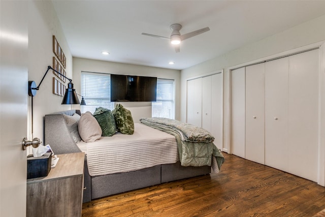 605 Devonshire Dr, Richardson, TX 75080 - bedroom featuring two closets, wood finished floors, and a ceiling fan