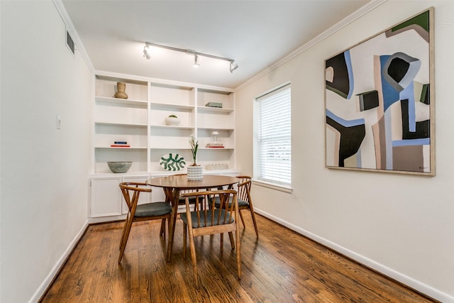 605 Devonshire Dr, Richardson, TX 75080 - dining space featuring dark wood-style floors, baseboards, and rail lighting